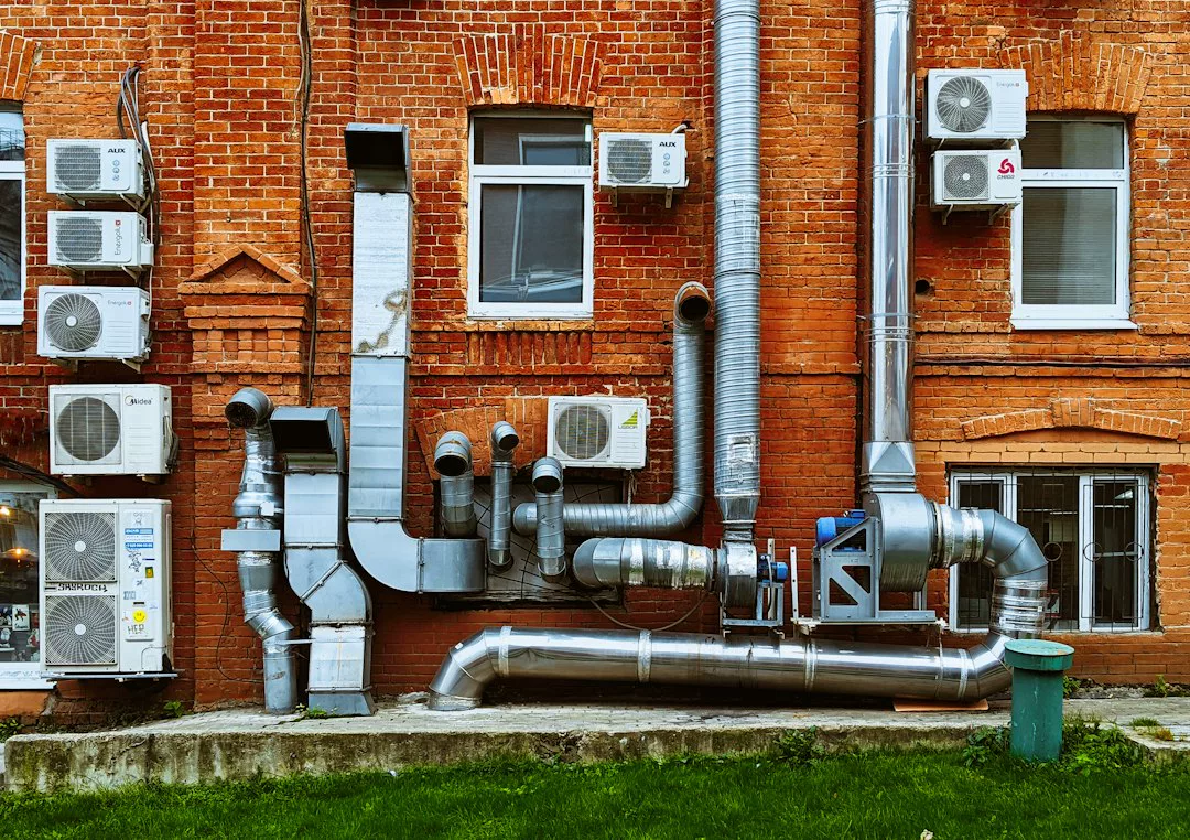 a building with a bunch of pipes on the side of it